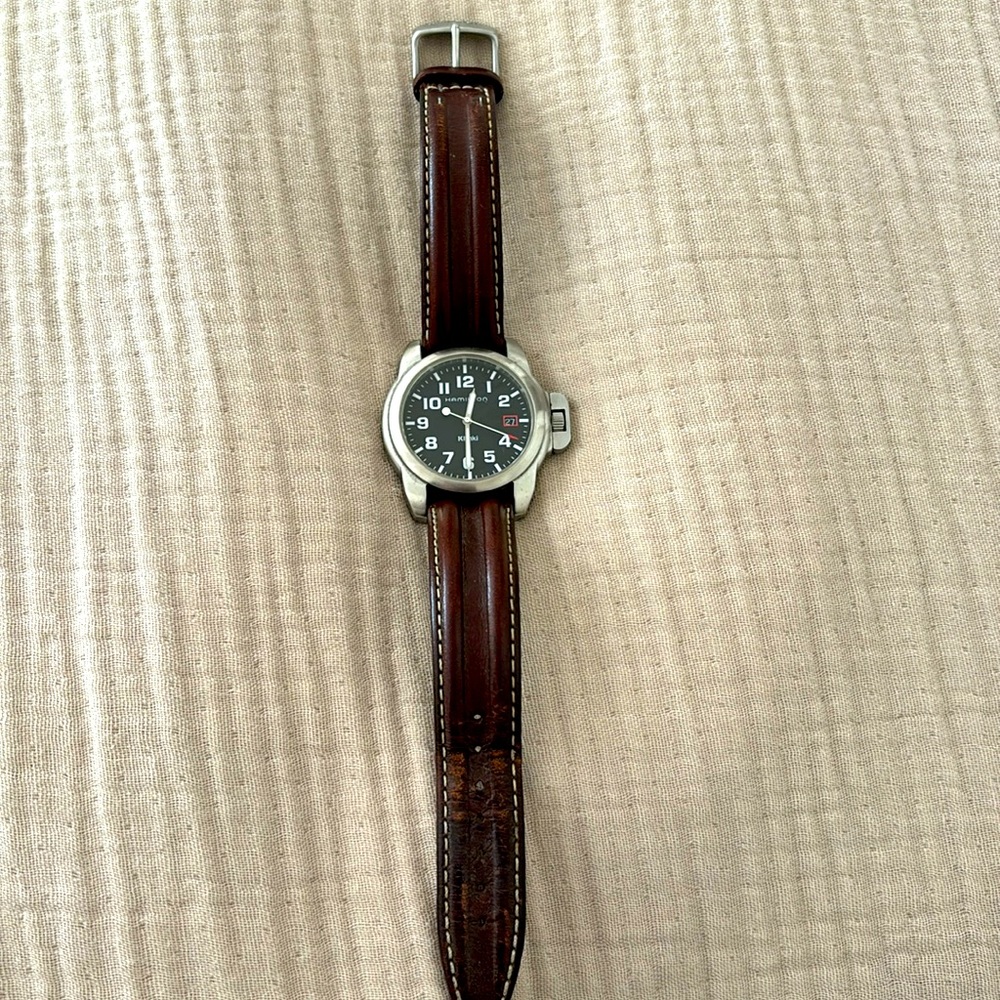 Men’s Hamilton watch, with black face, brown leather strap and gun metal finish.